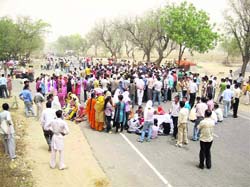 Students of the Chaudhary Devi Lal College of Engineering, Panniwala Mota, block traffic in Sirsa on Thursday following the death of a student. 
