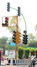 New ultramodern traffic lights (green poles) being installed at various chowks, which were shortened by the Municipal Corporation to smoothen the traffic flow, in Amritsar