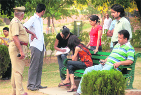 Victims of eve-teasing give statement to the police at Sector 11 park in Chandigarh on Friday.