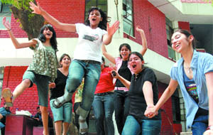 Class XII students of St. Thomas School rejoice after results at the school in New Delhi on Friday.