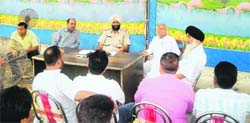 A meeting between police officials and area residents held at the city police station in Bassi Pathana