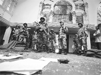 Armed police inspect a blast site inside Assumption Church in Kathmandu on Saturday.