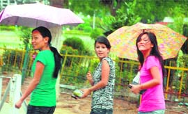 These girls seem to be having an enjoyable time in the rain that hit Chandigarh on Sunday. Heavy rain and hailstorm brought respite for the Chandigarhians as the temperature came down considerably