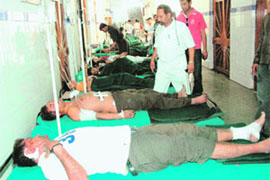 Injured Gujarati tourists get treatment in Doon Hospital in Dehradun on Sunday.