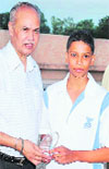Cadet Karan Sohi  receives the U-14 Best Swimmer award in Dehradun on Sunday. 