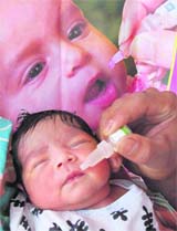 A child being given polio drops at a booth in Faridabad on Sunday