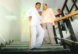 Two differently abled persons use the stairs as lifts at the mini-secretariat in Gurgaon are non-functional.