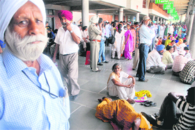 Passengers stranded at the Sector 43 ISBT in Chandigarh on Monday.