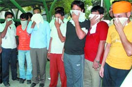 Members of a gang of vehicle thieves arrested by the Delhi polices special cell in New Delhi on Monday