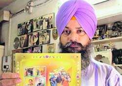 Dr Narinder Pal Sing exhibits his prized collection of Bhutanese stamps on Manmohan Singh