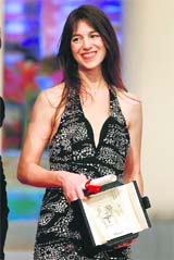 Actor Charlotte Gainsbourg reacts after receiving the Best Actress award for the film Antichrist. Reuters photos: Eric Gaillard