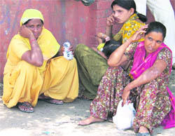 Passengers at the bus stand in Ropar on Monday.