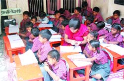 Students study in their class at Citizen Forum Vidhya Mandir School, Maqboolpura.