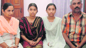Sabiya seated next to her father Qurban Ahmed. Also seen in the picture are her sister Ruhi and mother.