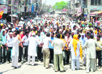 Members of the Dalit community hold a protest in Karnal on Tuesday over the Vienna killing.