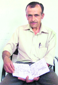 Madan Lal shows the design of the engine.
