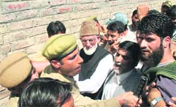 The police arrests Hurriyat leader Syed Ali Shah Geelani for defying house arrest in Srinagar on Tuesday. Geelani was scheduled to launch an anti-poll campaign in the Hazratbal Assembly constituency. 