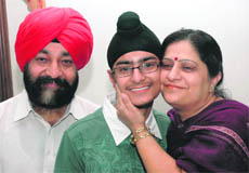 Prabal Pratap Singh with his parents in Jalandhar on Tuesday.