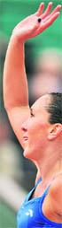 Jelena Jankovic waves after winning her match against Petra Cetkovska at Roland Garros on Tuesday.
