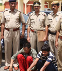 The suspects arrested in connection with the murder of a shopkeeper of Sikanderpur village in Gurgaon on Wednesday.