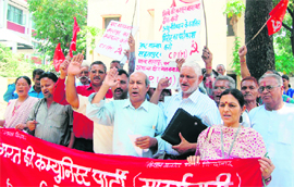 Activists of the CPM hold a protest in front of the office of the Dehradun district magistrate on Thursday.