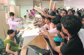 Residents scramble to get their licences and passports made at Gurgaons e-disha centre. These computerised centres had been set up for the  convenience of the public