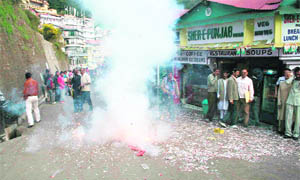Congress workers celebrating after the induction of Virbhadra Singh in the Union Cabinet in New Delhi on Thursday.