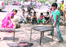 Life returns to normal for gypsies too as they perform in Basti Jodhewal area of the city on Thursday.