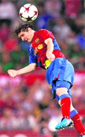 CLINCHING HEADER: Barcelonas Lionel Messi scores a goal against Manchester United at the Olympic Stadium. Messi scored maximum number of nine goals in Champions League. 
