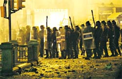 The police confronts Barcelona's supporters after unrest broke out in Barcelona early Thursday as fans celebrated their teams victory over Manchester United in the Champions League final. 