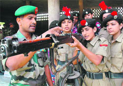 An instructor demonstrates the working of a rifle at a training camp for NCC cadets in Chandigarh, on Friday.