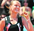 Agnes Szavay of Hungary gestures after defeating Venus Williams of the US at Roland Garros
