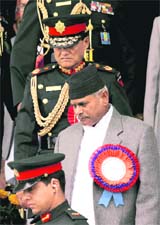 Nepalese President Ram Baran Yadav and Army Chief General Rookmangud Katawal leave after a function celebrating Nepals Republic Day in Kathmandu today
