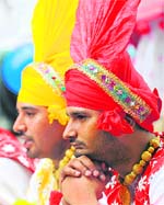 Bhangra artistes wait for their turn to perform at the Himalayan Day festival in Sydney on Friday