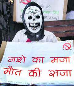 A student wears a mask during an awareness rally on the eve of World No Tobacco Day in Faridabad on Saturday.