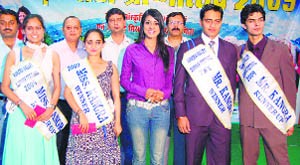 Contestants of Mr and Miss Kangra contest with Sa Re Ga Ma Pa fame Himani Kapoor during the summer festival at Dharamsala on Saturday.
