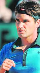 Roger Federer reacts after winning a point against Paul-Henri Mathieu at Roland Garros on Saturday.