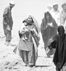 An internally displaced woman flees a military offensive in the Swat region on Saturday.