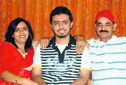 Siddharth Bora with his parents in Dehradun on Sunday.
