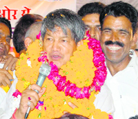Harish Rawat with supporters in Haridwar.