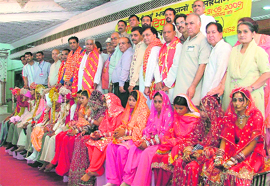 Newly married couples after a mass marriage ceremony performed by Shree Durga Sewak Sangh in Ludhiana on Sunday.