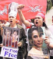 Activists raise slogans calling for the immediate release of detained pro-democracy leader Aung San Suu Kyi during a protest outside the Myanmar embassy in Bangkok on Sunday. 