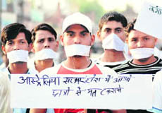 Residents hold a silent procession in Karnal on Monday in protest against the lathi charge on Indian students in Australia.