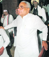  MP from Haryana Bhajan Lal arrives at Parliament House to attend the first session of the 15th Lok Sabha in New Delhi on Monday.
