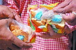 The police displays packets of drugs, stuffed in rusks, which were seized from a person trying to smuggle them into the Central Jail in Jalandhar on Monday. 