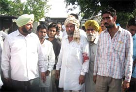 Two of the injured persons during a clash between the truck union members and an industrial unit at Moga