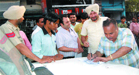 Health officials challan people for smoking in public in Amritsar.