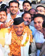 BJP workers welcome Bhagat Singh Koshyari in Haridwar on Monday