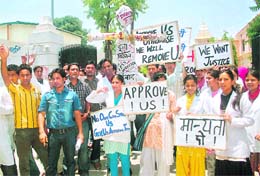 Junior doctors of Gurukul and Rishikul Medical Colleges hold a protest in Haridwar on Tuesday. 