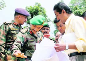 Residents of Chandmari village and the Army authorities discuss a point